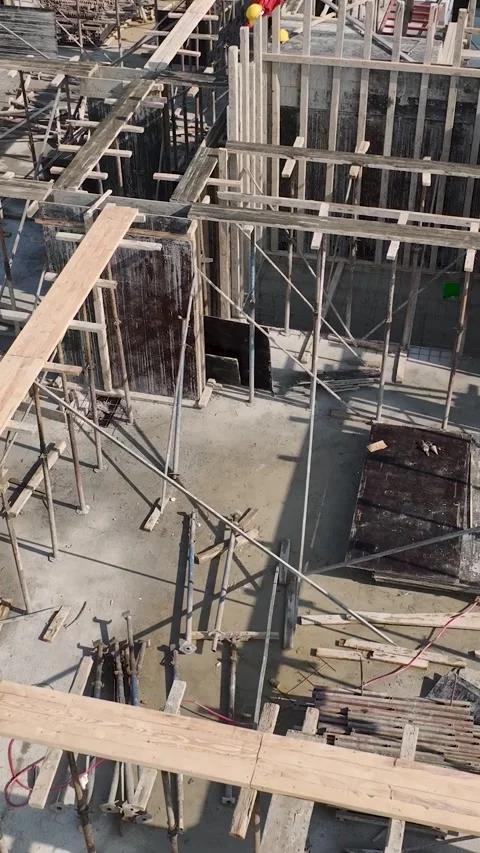 Vertical Video of Crew Securing Exterior Wall at Construction Site Stock Footage 342406625