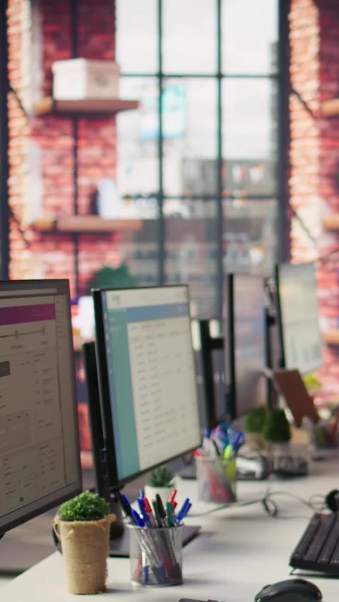 Vertical video CSM interface on computer monitors and audio headsets in empty Stock Footage 306059598