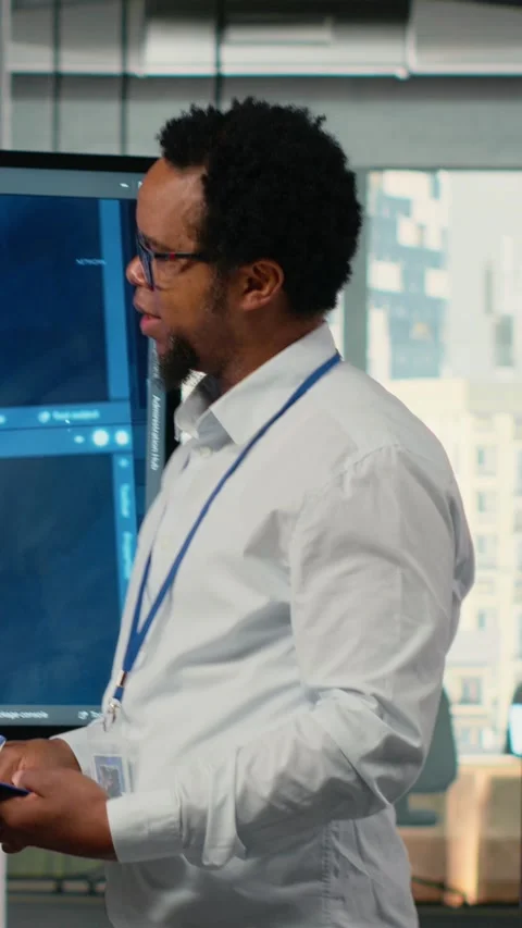 Vertical video CTO in startup office doing presentation on deep learning tech to Stock Footage 323403652