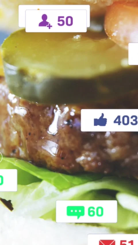 Vertical video: Cursor clicking badges, revealing burger stack while icons Stock Footage 328398471
