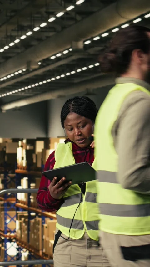 Vertical Video Customer service operator, managing calls, shipment details Stock Footage 330375853