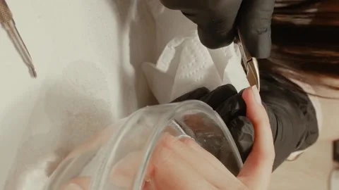 Vertical video of cutting cuticle Stock Footage 155870086