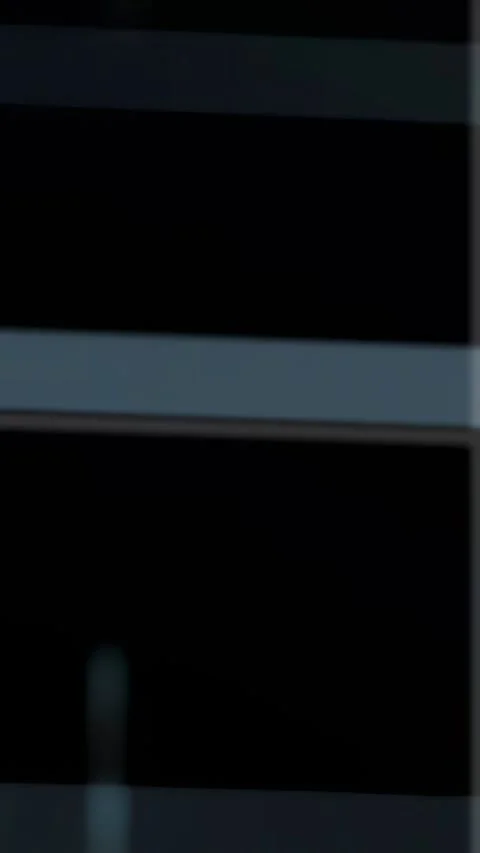Vertical video: Cyan glow arising center starting columns, binary digits moving, Stock Footage 334378255