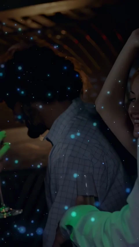 Vertical video: Dancing couple swaying after glove touch at bar in shiny dress Stock Footage 334396680