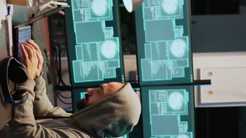 Vertical video: Dangerous IT coder working on security breach Stock Footage 222213486