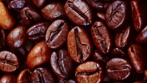 Vertical video, Dark brown roasted coffee beans circle rotation close up Stock Footage 248088372