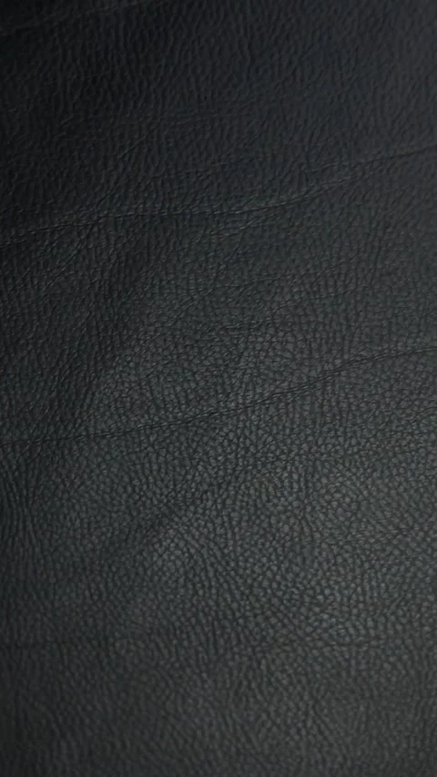 Vertical video of dark leather background Stock Footage 240469183