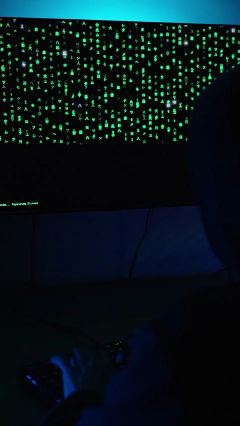 Vertical video. Dark Room with Computer Setup, Monitor Showing Green Matrix Code Stock Footage 281462286