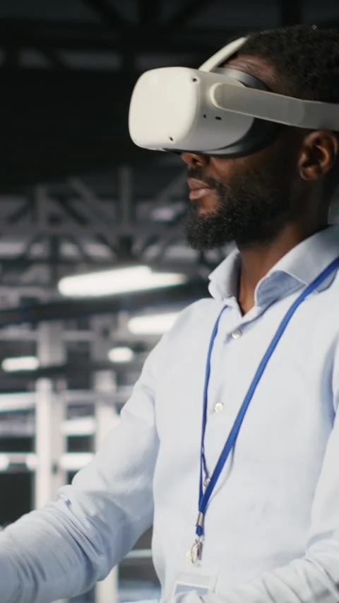 Vertical video Data center admin using VR headset to monitor neural network AI Stock Footage 310778405