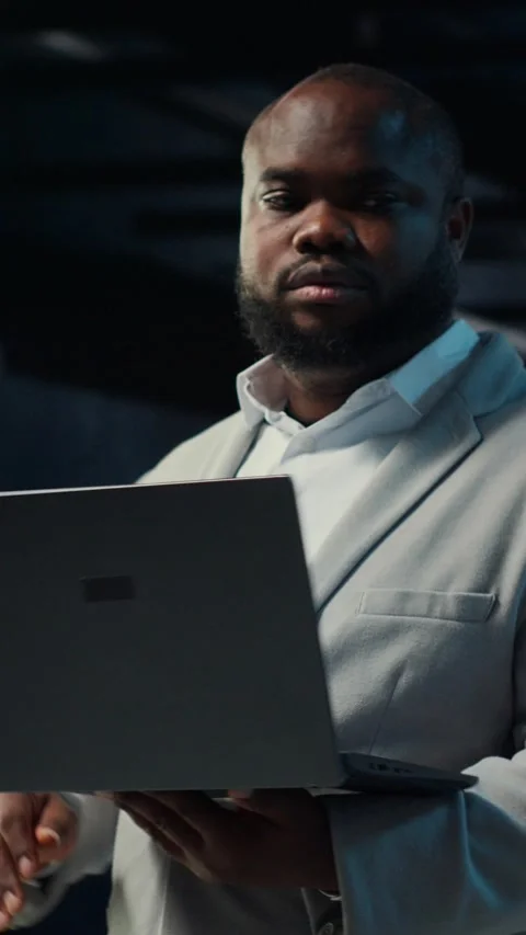 Vertical video Data center admin coding, writing script on laptop, identifying Stock Footage 311414511