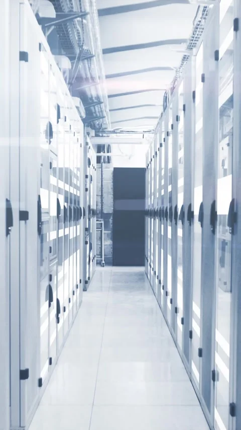 Vertical video: Data center aisle moving forward as camera dolly starts, Stock Footage 348374631