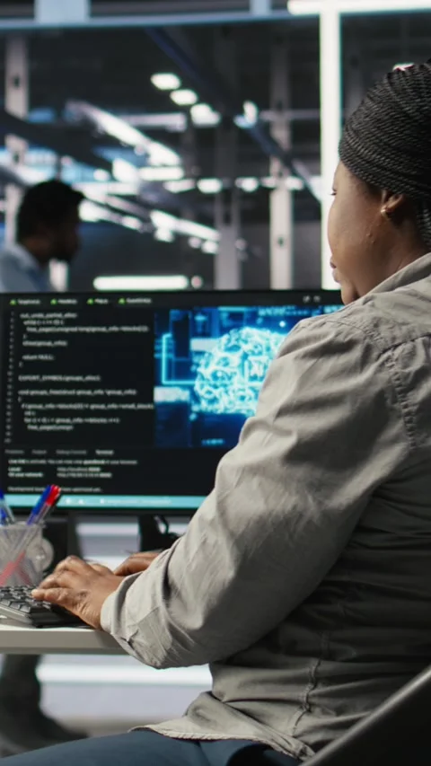 Vertical video Data center employee deploying AI solutions optimizing equipment Video stock 307968852