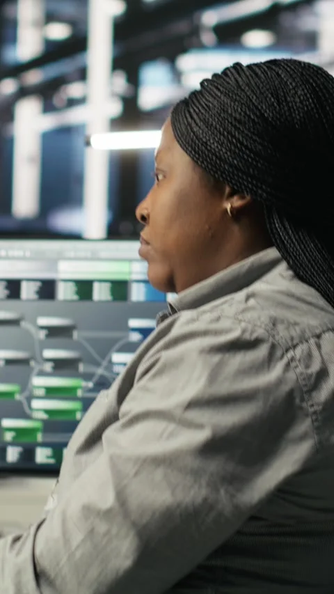Vertical video Data center employee deploying AI solutions optimizing equipment Video stock 308752046