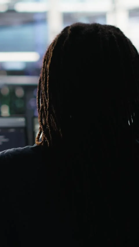 Vertical video Data center engineer using algorithms to analyze datasets Stock Footage 308756925