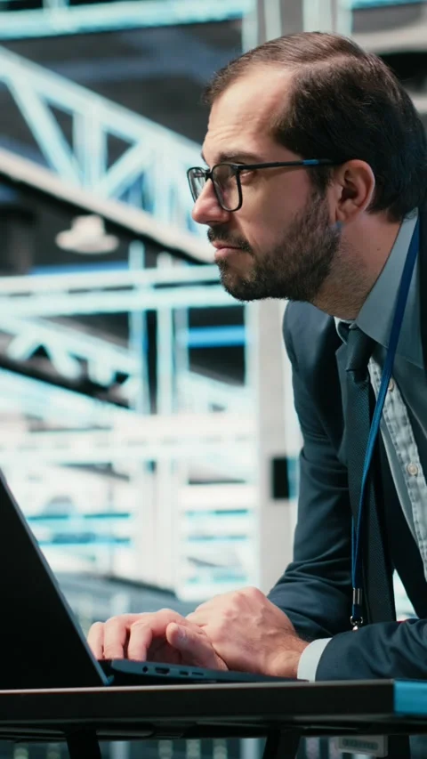 Vertical video Data center engineer uses laptop and augmented reality simulation Stock Footage 329590625