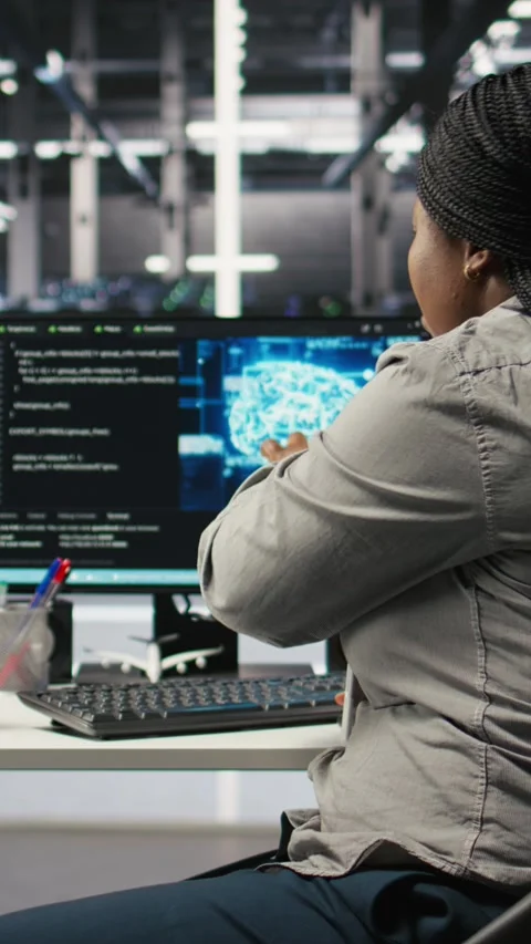 Vertical video Data center engineering team deploying AI solutions optimizing Stock Footage 308756890