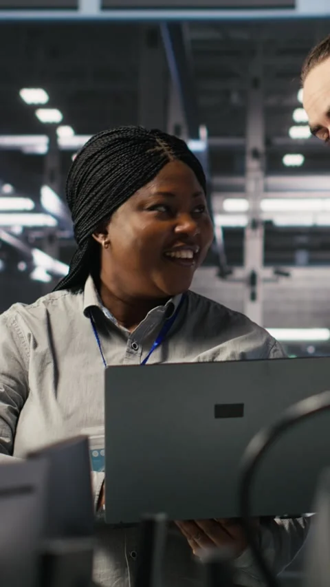 Vertical video Data center engineering team collaborating on blade servers Stock Footage 309254863