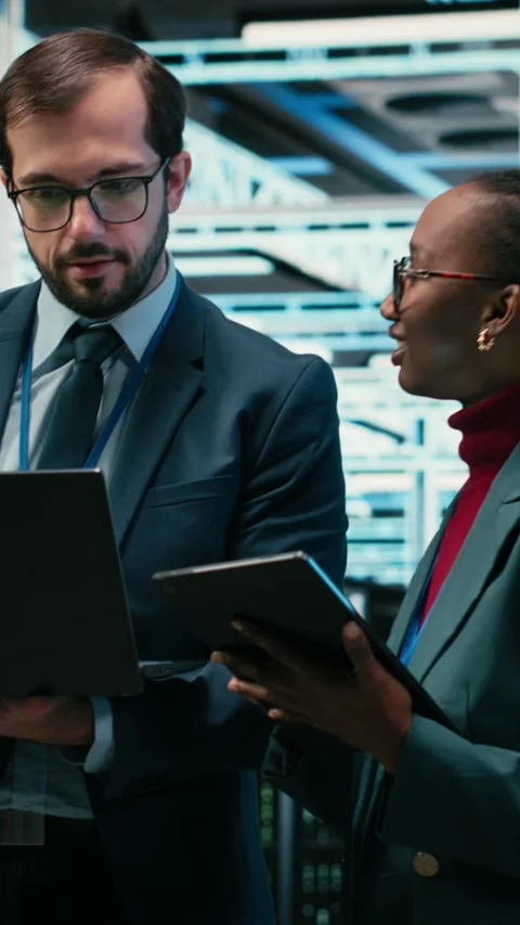 Vertical video Data center engineering team using AR tech, working together Video stock 329451035