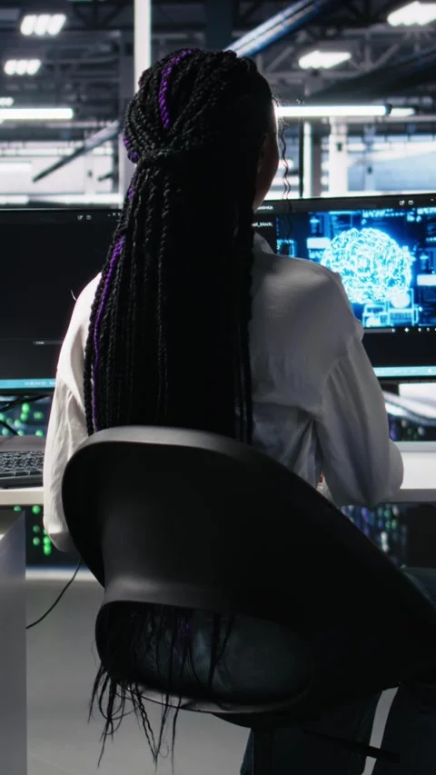 Vertical video Data center female programmer uses machine learning algorithms to Stock Footage 313457052