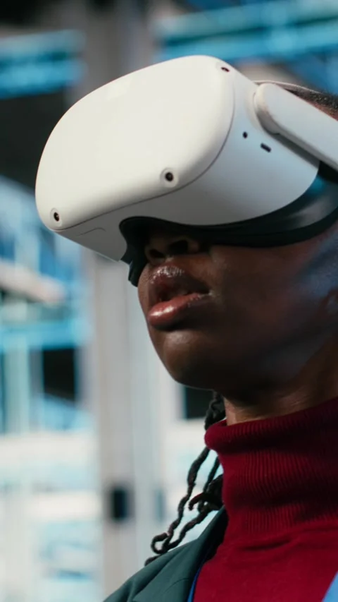 Vertical video Data center female engineer putting VR glasses on to do gear rigs Stock Footage 329713369