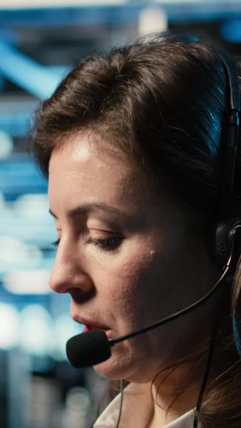 Vertical video Data center IT support worker diagnosing issues using AR Stock Footage 329320559