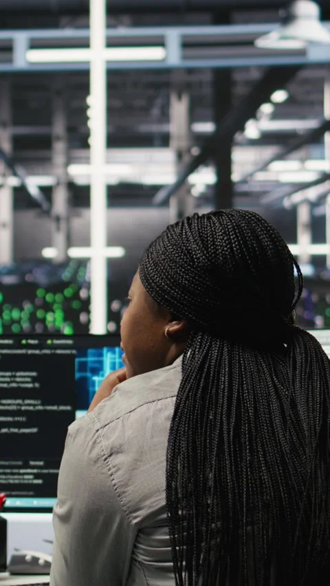 Vertical video Data center manager supervising worker deploying AI solutions Stock Footage 308756495