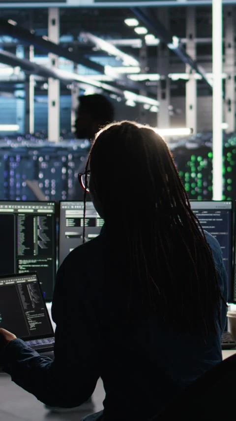 Vertical video Data center programmer entering office uses node tree program Stock Footage 308757167