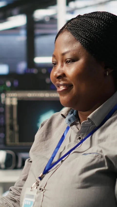 Vertical video Data center programmer coding on PC, doing software updates for Stock Footage 309255865