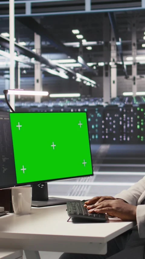 Vertical video Data center programmer coding on green screen PC, monitoring AI Video stock 309488060