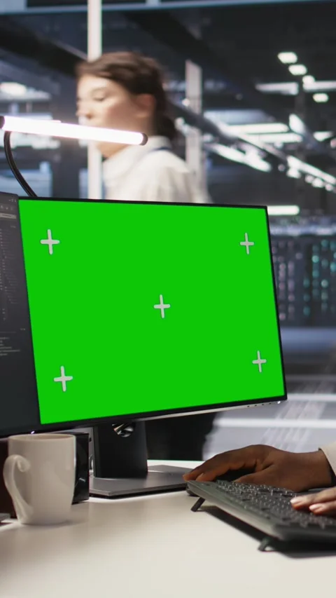 Vertical video Data center programmer working on green screen desktop PC Stock Footage 309488182