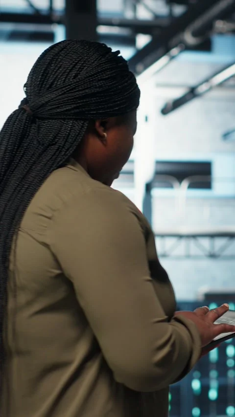 Vertical video Data center programmer uses tablet to develop disaster recovery Stock-Footage 317055163