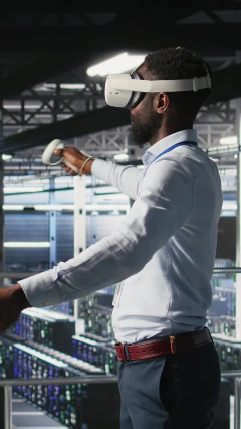 Vertical video Data center programmers on industrial platform using virtual Stock Footage 310778745