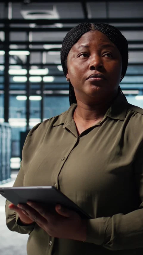 Vertical video Data center software developer monitors data center metrics on Stock Footage 316858780