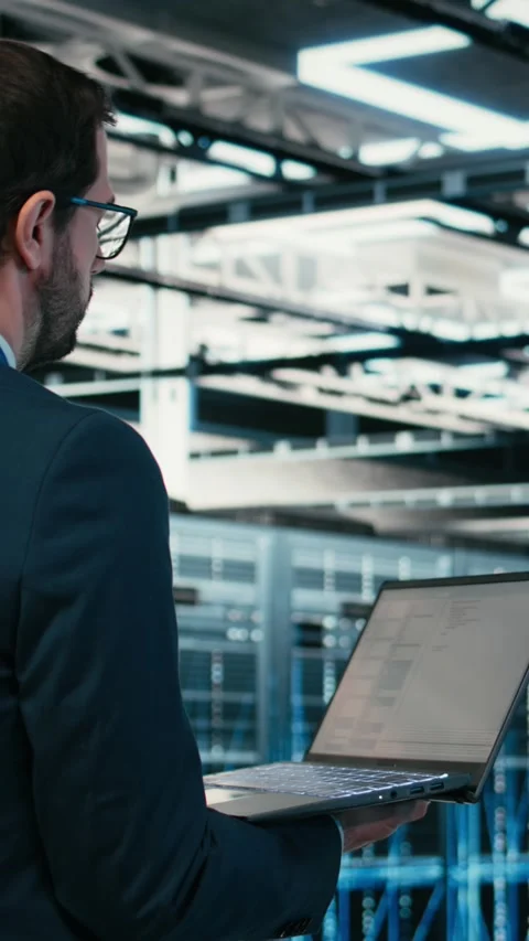 Vertical video Data center software developer writing code optimization using Stock Footage 329590999