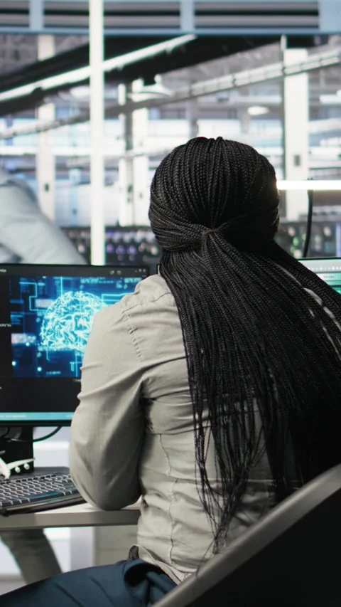 Vertical video Data center staff member in office using AI deep learning Stock Footage 308757624