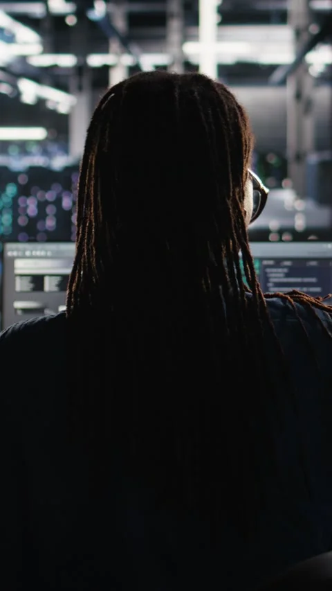 Vertical video Data center system administrator using algorithms to analyze Stock Footage 307971249