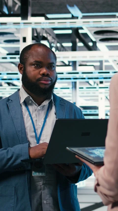 Vertical video Data center team of technicians uses AI deep learning on devices Stock Footage 330028616