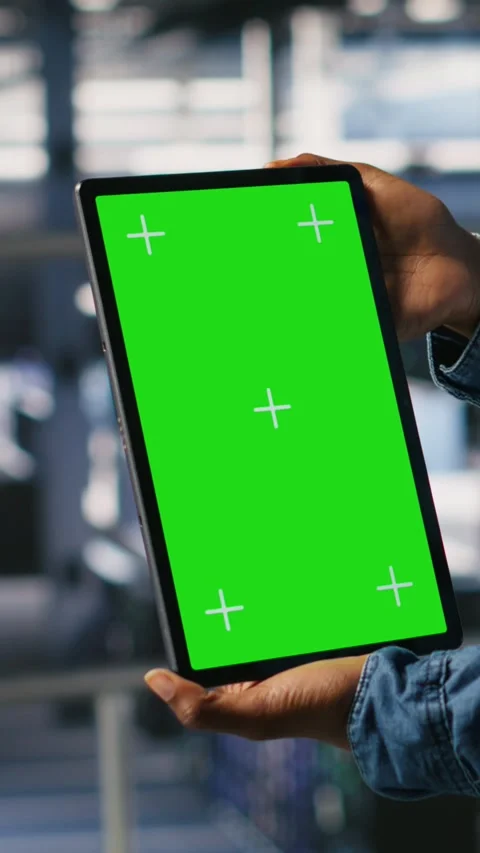 Vertical video Data center worker using green screen mockup tablet, doing Stock Footage 310776418
