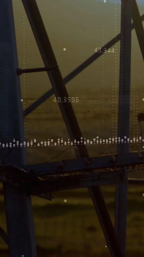 Vertical video: Data overlay starting, camera panning over metal lattice at Stock Footage 334541031