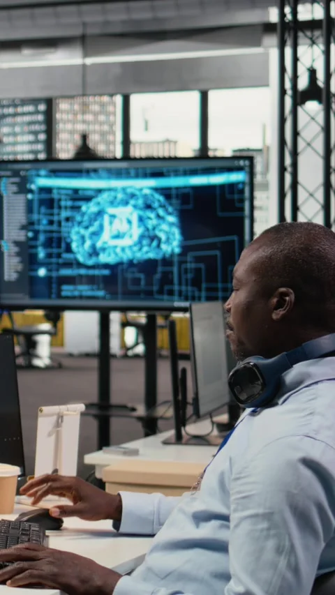 Vertical video Data scientist in office doing software development to launch new Stock Footage 322696792