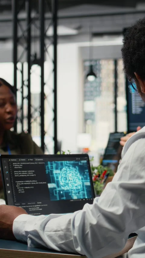 Vertical video Data scientists in startup office brainstorming leveraging AI Stock Footage 323142606