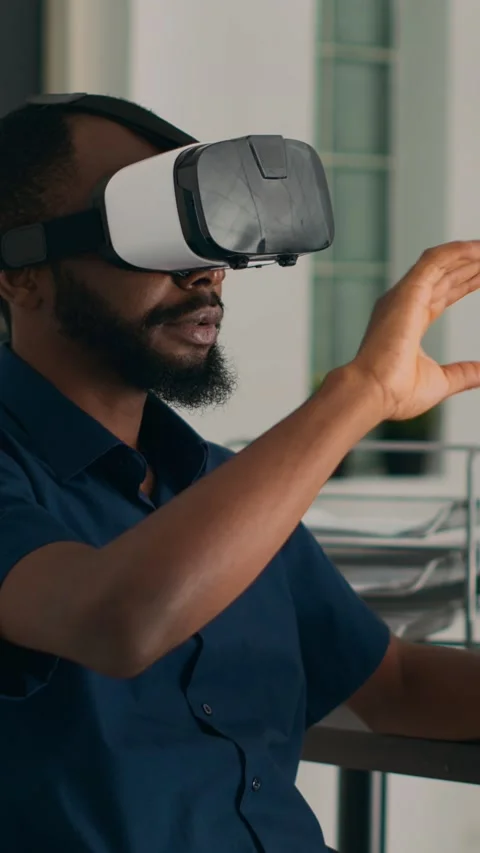 Vertical video: Database admin working with virtual reality glasses to develop Stock Footage 218575142