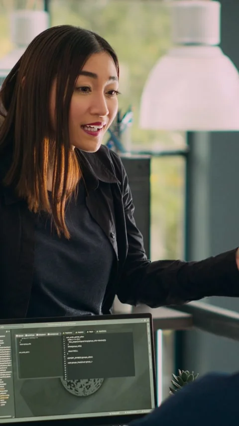 Vertical video: Database admins doing highfive gesture to celebrate coding Stock Footage 218577667