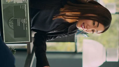 Vertical video: Database admins doing highfive gesture to celebrate coding Stock Footage 219702745