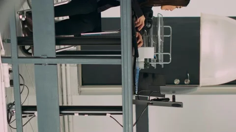 Vertical video: Database programer with physical disability writing code on Stock Footage 220160023