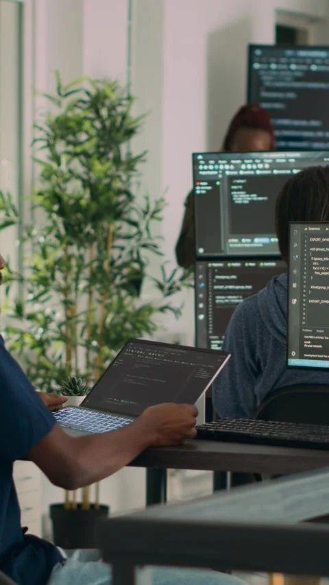 Vertical video: Database programer working on html script code to develop Stock Footage 218575293