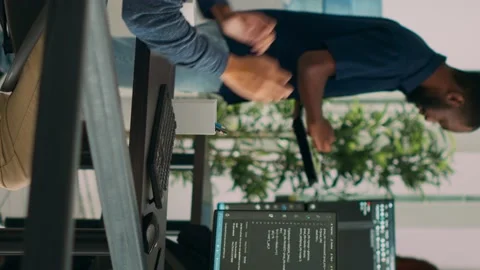 Vertical video: Database programer writing source code and developing security Stock Footage 220102717