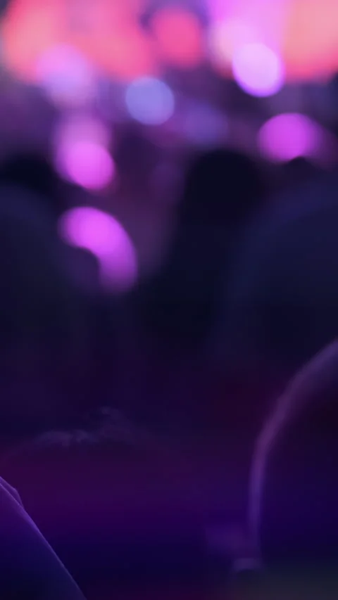 Vertical video: Defocused concert background in purple stage light. Copy space Stock Footage 294070885