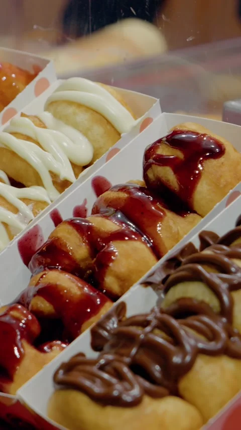 Vertical video Delicious donuts filled with jam served at a festive Christmas Stock Footage 316486383