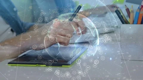 Vertical video: Designer hand lowering stylus, drawing while globe rotating over Stock Footage 331380267